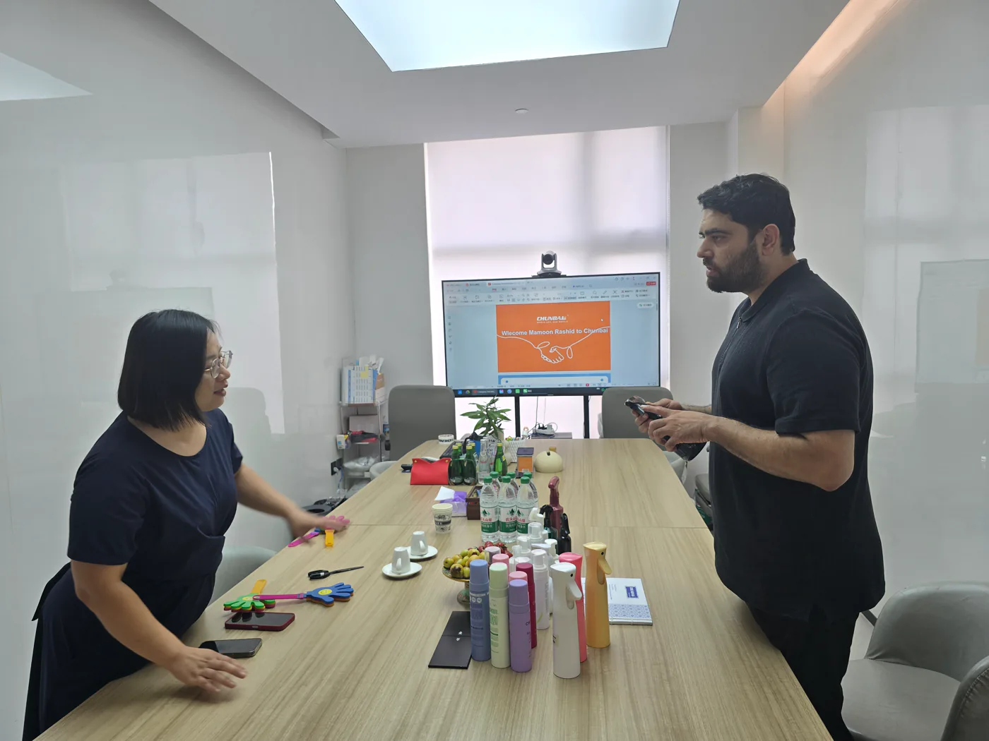 Supplier meeting with physical product samples arranged on the table