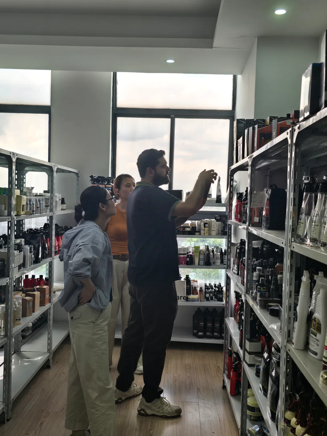 Nexus representative reviewing a supplier product range in a sample room