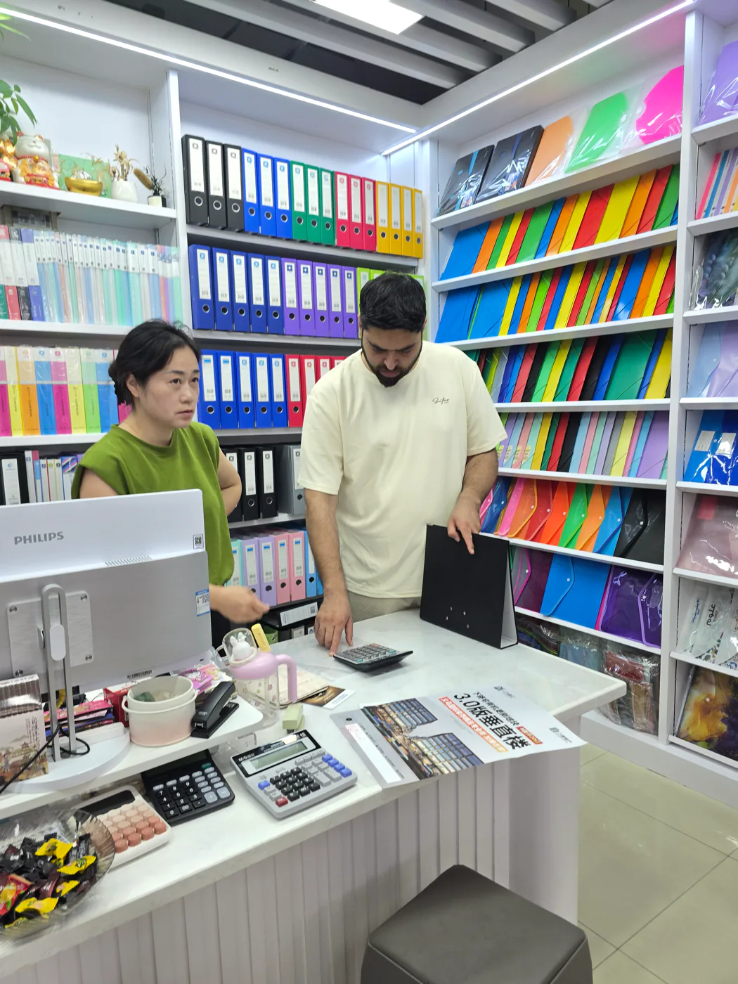 Nexus representative and supplier comparing product samples in a showroom